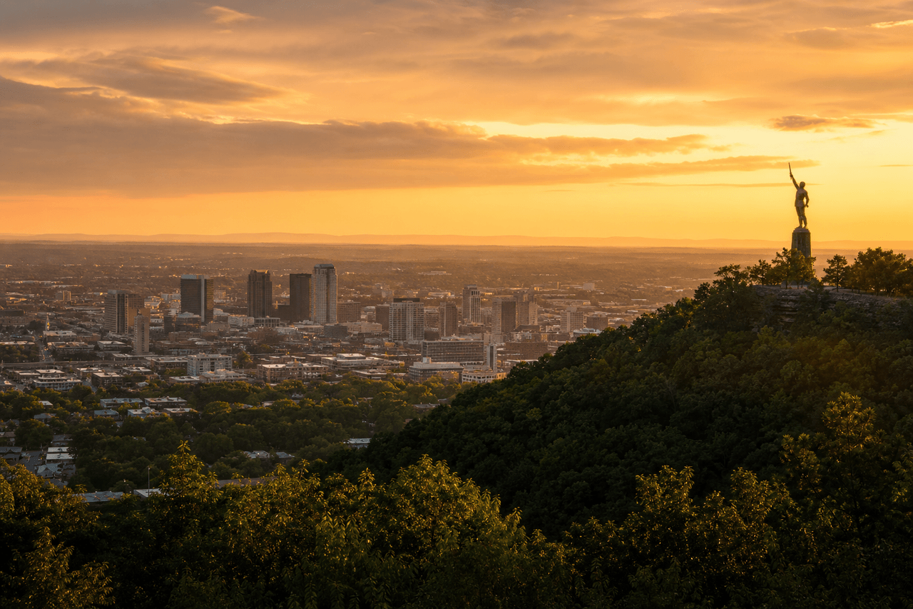 Birmingham Alabama skyline at golden hour with the Vulcan statue on Red Mountain — best movers in Birmingham